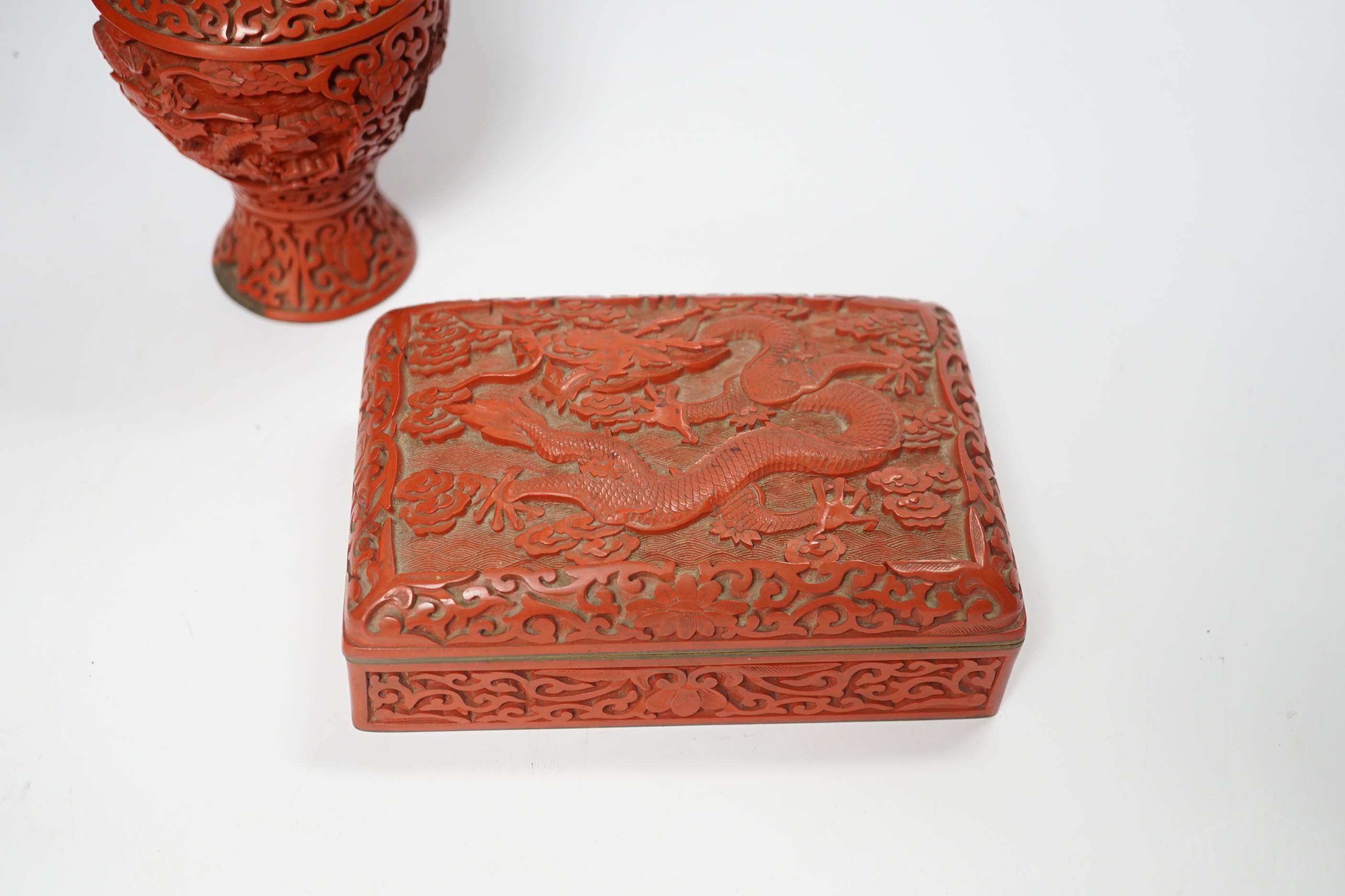 Three Chinese cinnabar lacquer items, a vase, an ashtray and a lidded box, vase 16.5cm